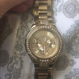 Guess Rhinestone Gold-Tone Multifunction watch.